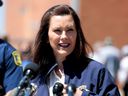 Michigan Governor Gretchen Whitmer addresses the media in downtown Midland, Michigan on May 20, 2020.
