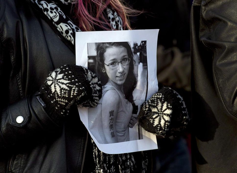 A woman holds a photo of Rehtaeh Parsons at a vigil on April 11, 2013 in Halifax.