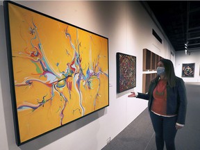 Jennifer Matotek, Executive Director of the Windsor Art Gallery, alongside an original Alex Janvier pendant at AGW last year.  The gallery will kick off a new series of monthly panel discussions on Thursday with a conversation about how the community can mark Canada's newly created National Truth and Reconciliation Day.