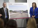 Bryce Phillips, left, executive director of the Windsor-Detroit Bridge Authority, and Gretchen Whitmer, governor of Michigan, pose alongside selected designs for the Michigan Interchange pedestrian bridges during a press conference at the Bridge community office. Gordie Howe International in southwest Detroit, Thursday, Jan.9, 2020.