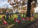 Canadian flags decorate veterans' graves at Windsor Grove Cemetery in November 2019.