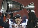 Martin Bédard of the Montreal Alouettes lifts the Gray Cup after his team won it in 2009.