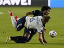 DC United midfielder Russell Canouse and CF Montreal midfielder Ahmed Hamdi collide during Wednesday night's game in Fort Lauderdale, Florida.