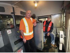 Burton Dauncey, left, deputy chief mechanical officer and retired engineer Greg Devreker appear Monday inside the cabin of the Essex Terminal Railway's 105th locomotive, which was completely overhauled and repainted.