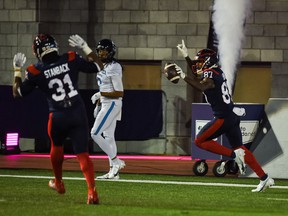 Montreal Alouettes wide receiver Eugene Lewis (87) scores a touchdown against the Toronto Argonauts in the second quarter during a Canadian Soccer League game at Molson Stadium.