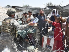 Soldiers from the Turkish Task Force in Afghanistan were on duty in and around Hamid Karzai International Airport to assist people awaiting evacuation in Kabul, Afghanistan, on August 23, 2021.