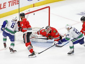 Vancouver Canucks right wing Brock Boeser (6) scores against Chicago Blackhawks goalkeeper Kevin Lankinen (32) during the second period at the United Center.