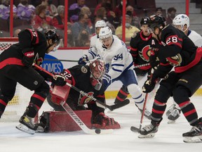 Ottawa Senators goalkeeper Filip Gustavsson (32) saves Toronto Maple Leafs center Kirill Semyonov (94) in the first period at the Canadian Tire Center on Wednesday.