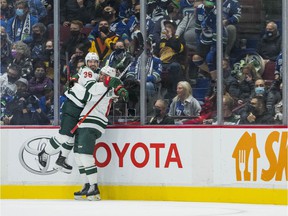 Minnesota Wild Mats forward Zuccarello (36) and forward Joel Eriksson Ek (14) celebrate Zuccarello's goal against the Vancouver Canucks in the first period at Rogers Arena.