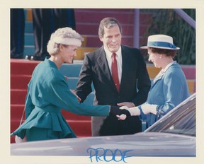 October 15, 1987 British Columbia Prime Minister Bill Vander Zalm introduces his wife Lillian (left) to Queen Elizabeth during a royal visit to British Columbia.  Someone has written "proof" in blue print "crayon," to allow an editor to view the image when choosing photos for the newspaper.  But it never worked.  Peter Hulbert / Province
