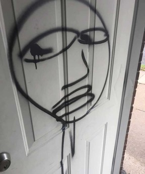 A graffiti tag left on the front door of a residence on Drouillard Road in Windsor.  Photographed October 15, 2021. Image courtesy of Milena Chojnacki.