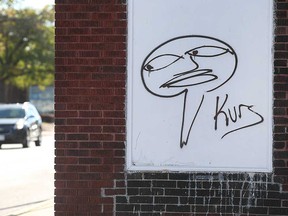 Graffiti vandalism with the recurring tag KURS, left at a residence on Drouillard Road in Windsor.  Photographed on October 19, 2021.