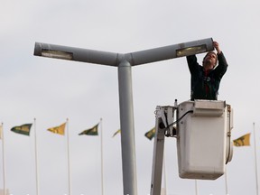 Edmonton City Electrician Kevin Biggelaar changes the lights on what he calls 