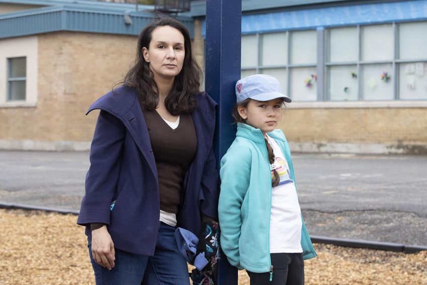 Queen's University mother and professor Nora Fayed with her 8-year-old daughter Donya Faulhaber.  Fayed says the lack of transparency, clarity and standardization in tracking vaccinations on school boards makes decision-making difficult.