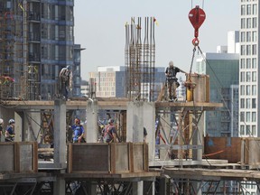 Workers on the top floor of a high-rise construction project in downtown Vancouver in 2013.