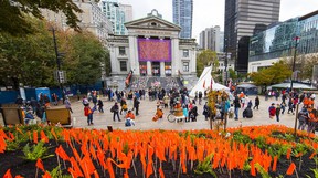 Hundreds of people gathered in front of the Vancouver Art Gallery in downtown Vancouver.