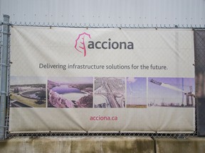 A sign for the Spanish multinational Acciona on a fence at the construction site of the wastewater treatment plant in North Vancouver.