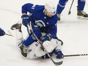 VANCOUVER, BC - January 6, 2021 - Vancouver Canucks Jonah Gadjovich rides Zack MacEwen during a hitting game at Rogers Arena in Vancouver, BC on January 6, 2021. Covid-19 pandemic restrictions were in effect for photographers who offered limited shooting positions.  Photo by Arlen Redekop / Vancouver Sun / The Province (PNG) (journalist article) [PNG Merlin Archive]