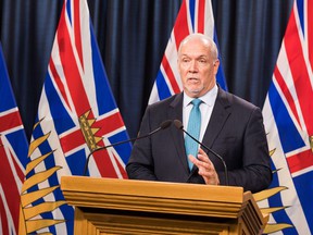 British Columbia Prime Minister John Horgan, seen here addressing the media on October 21, said British Columbia is already feeling the effects of climate change with wildfires, 