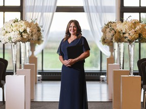 Wedding officiant Kristen Olynick poses for a photo before officiating a wedding at Swaneset Golf Course in Pitt Meadows on Sunday.