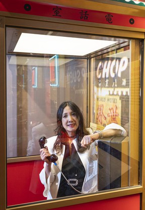 Carol Lee, president of the Vancouver Chinatown Foundation, who purchased a building on East Pender Street in 2017 for the Chinatown Storytelling Center, in the replica of the pagoda's phone booth.