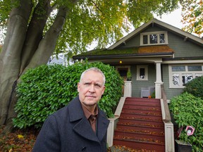 Tyman Stewart in front of his home in Vancouver.