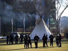 While most of the camp protests COVID-19 vaccines, indigenous injustices have been removed from the grounds of the Alberta legislature, a few teepees remain with a large police presence remaining nearby on Monday, October 25, 2021 in Edmonton. .  Greg Southam-Postmedia