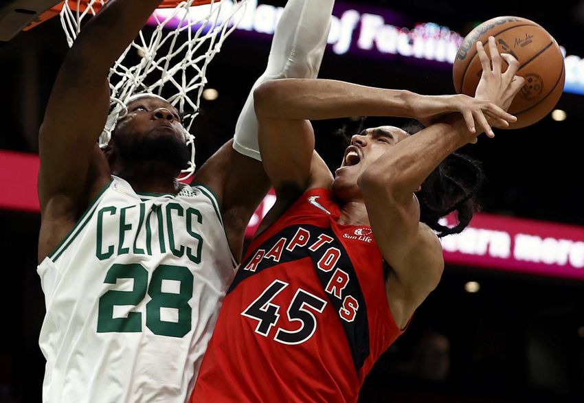 The Celtics' Bruno Fernando blocks Raptors rookie Dalano Banton in Saturday night's preseason game in Boston.