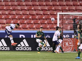 Vancouver Whitecaps FC forward Lucas Cavallini heads the ball for a goal against the Portland Timbers during the second half of the Caps' season opener at Rio Tinto Stadium.