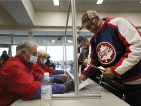 Fans display their proof of vaccination at the Windsor Spitfire season opener on Thursday, Oct. 7, 2021 at the WFCU Center.