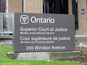 A sign on the Superior Court of Justice building in Windsor in April 2020.