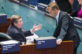 Toronto Mayor John Tory speaks with Councilman Joe Cressy in the Council Chamber at City Hall on Monday, Aug. 20, 2018.