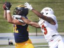 WINDSOR, ONTARIO.  OCTOBER 2, 2021: Bennett Vani, left, of the University of Windsor intercepts a pass destined for AJ Chase of the University of Guelph on Saturday, October 2, 2021 at Alumni Field in Windsor.