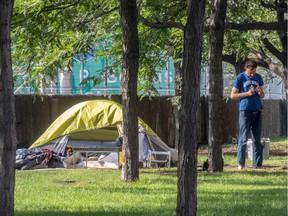 The pandemic has added to homelessness in Montreal on Tuesday, September 8, 2020. Some homeless men are camping in a green space along Viger Avenue near the Palais des Congres.  Dave Sidaway / Montreal Gazette ORG XMIT: XXXXX