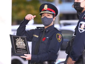 Windsor Police Chief Pam Mizuno is featured in a 2020 file photo accepting a plaque of appreciation from the Mayor of Windsor, Drew Dilkens, for the ongoing crime prevention efforts and service of the Police Service staff. Windsor Police during the pandemic.
