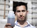 Fernando Sánchez-Quete, research assistant at McGill University, with sewage water tested for COVID-19.