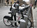 Norbert Lavoie prepares to enjoy a Bixi ride at Laurier St. Station on the first day of the season on Wednesday.