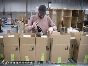 Online orders are prepared at the SAQ East End Warehouse on May 13, 2020.