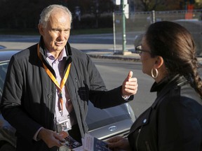 Peter Malouf campaigning for mayor at TMR, speaks with local resident Lori Ann Emanovich on Graham Blvd. while campaigning door-to-door on Thursday, Nov. 4, 2021.