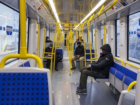 Passengers depart Tunney's Pasture Station on the first day of the resumption of LRT service on Friday.