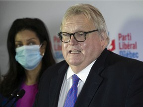 Liberal MNA Gaétan Barrette announces that he will not seek re-election in 2022 at a press conference in Montreal on Sunday, November 14, 2021. Joining him is Quebec Liberal leader Dominique Anglade.