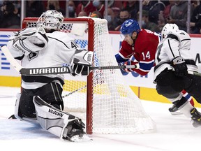 Los Angeles Kings defender Tobias Bjornfot chases Montreal Canadiens center Nick Suzuki as he tries to engulf goalkeeper Cal Petersen in Montreal on November 9, 2021. Suzuki hit the post on the play.