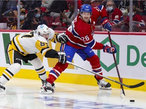 Montreal Canadiens defender Jeff Petry is pressured by Pittsburgh Penguins center Sidney Crosby during the second period in Montreal on November 18, 2021.