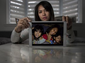 Lalaine Canillo has not seen her three daughters (in the photo, from left to right: Alexxianie Pierre, Alexa Madelaine and Alexandrea Camerron) since 2019.