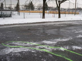 Police markings delineate an area where bloodstains were found at the scene of a stabbing in Marc-Aurèle-Fortin park in Laval on January 2, 2020.