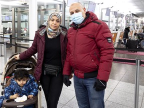 Travelers Ahmed Saleh, from right to left, his wife Eman Nossir and son Ali Saleh are forced to find another way to travel after their flight was canceled at the last minute, at Pierre-Elliott Trudeau International Airport in Montreal , Monday, November 29.  2021.