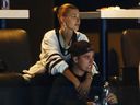 Justin Bieber reacts and his wife Hailey Bieber looks on during game 7 of the Eastern Conference first round during the 2019 NHL Stanley Cup playoffs between the Boston Bruins and the Toronto Maple Leafs at the TD Garden on April 23, 2019 in Boston.
