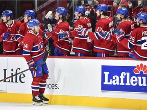Nick Suzuki of the Montreal Canadiens celebrates his goal during the third period against the Calgary Flames at the Center Bell on November 11, 2021.