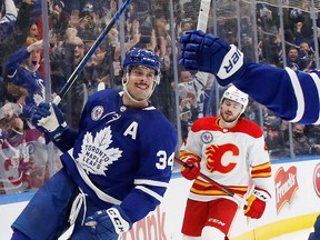 Auston Matthews # 34 of the Toronto Maple Leafs scores the game-winning goal at 2:32 in overtime against the Calgary Flames at Scotiabank Arena on November 12, 2021 in Toronto.