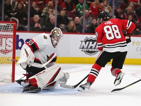 Patrick Kane # 88 of the Chicago Blackhawks shoots Matt Murray # 30 of the Ottawa Senators to score a goal in the third period for a hat trick at the United Center on November 1, 2021 in Chicago, Illinois.  The Blackhawks defeated the Senators 5-1 for their first win of the season.